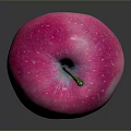 Fresh Pink Apple With White Spots On Black Surface Showing Reflection