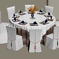 Round Dining Table Set With White Chairs Brown Covers Red Tassels Tableware And Orange Flowers
