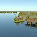 Serene Lakeside Scenery With Wooden Boardwalk Gravel Ground And Lush Vegetation