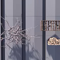 Creative Wall Decor with Twig Art and Wooden Shelf Holding Wood Logs on Gray Wall