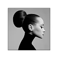 Profile View Portrait of a Woman With Sleek High Bun Hairstyle and High Neck Top