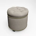 Round Tufted Light Gray Fabric Ottoman With Gold Nailhead Trim