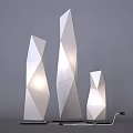 Three Geometric White Floor Lamps with Polygonal Design Illuminated Modern Interior