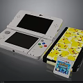 Nintendo 3DS Console With Pikachu Patterned Case And Pokémon Game Cartridge
