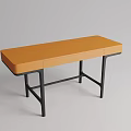 Minimalist Dressing Table With Orange Leather Top And Black Metal Frame Design