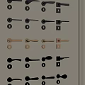 Various Styles and Colors of Door Handles Arranged on Gray Wall