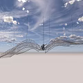 Large Metal Wing Shaped Hanging Decoration Suspended Under Blue Sky With Clouds