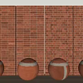 Four Decorative Terracotta Spheres Placed Against Red Brick Wall Backdrop 3d model