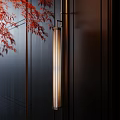 Elegant Cylindrical Wall Lamp On Dark Wooden Wall With Red Maple Leaves