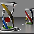 Modern Artistic Pillars With Spiral Colored Strips Yellow Blue Red And Green Grass Base
