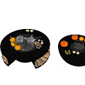 Modern Round Fireplace Interior Decorated With Fresh Fruits Teapots And Stacked Firewood