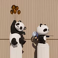 Panda Landscape Sculptures on White Pillars Featuring Gold Decorations and Blue Object on Wooden Wall