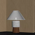 Beige Lampshade Table Lamp With Layered Base And Wooden Wall Background
