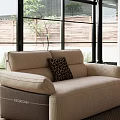 Modern Living Room Sofa Set With Beige Brown Couches Coffee Table Artwork And Natural Light