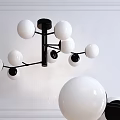 Modern Chandelier Featuring White Spherical Balls And Black Metal Frame Contemporary Design