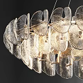 Elegant Modern Glass Chandelier With Circular Petal Design Hanging From Ceiling