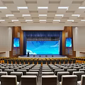 Spacious Modern Conference Room With Yellow Seats Central Podium And Blue Carpet
