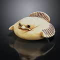 Flying Animal With Round Cream Colored Body And Dark Patterned Wings On Black Background