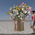 Large Woven Basket Floral Installation With Colorful Flowers And Pink Ribbon Bow In Outdoor Setting