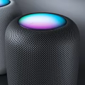 Two White And Black Cylindrical Smart Speakers With Colorful Light Rings On Top Modern Design