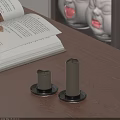 Two Lit Candle Lamps on Wooden Table with Open Book for Cozy Reading Atmosphere