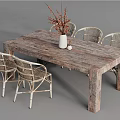 Rustic Wooden Dining Table Set with White Framed Wicker Chairs and Vase with Twigs