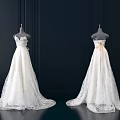 Two Elegant White Lace Long Wedding Dresses On Mannequins Against Black Background