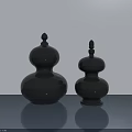 Two Black Gourd Shaped Decorative Sculptures On Smooth Surface With Light Background 3d model