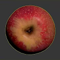 Fresh Red Apple With Yellow Spots On Dark Reflective Surface