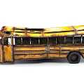 Vintage Yellow School Bus With Rusty Body And Aged Exterior Details