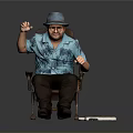 Man Sitting On Chair With Blue Floral Shirt Gray Hat And Electronic Devices