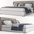 Modern Upholstered Double Bed With Neutral Tones Pillows And Throw Blanket