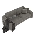 Light Gray And Green Two Seater Sofa With Decorative Pillows And Blanket