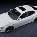 White Maserati Sedan With Sleek Body Design Black Alloy Wheels And LED Headlights