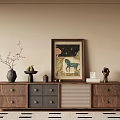 Wooden TV stand with drawers and decorative items including vase sculpture painting on beige wall