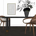 Elegant Black Dining Table Set with Wooden Armchairs Gray Cushions and Flower Vase