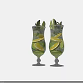 Two Refreshing Drinks with Lime Lemon Mint Leaves and Ice Cubes in Tall Glasses