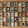 Colorful Books And Magazines Arranged On Wooden Shelves With Diverse Covers