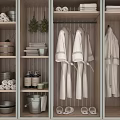 Organized Locker Storage With Hanging Robes Stacked Towels Toiletries Baskets Slippers And Green Plant Decor