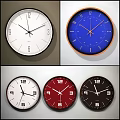 Various Modern Wall Clocks With White Blue Red Black Dials And Stylish Designs