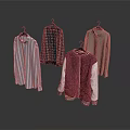 Various Stylish Clothing Items Hanging On Hangers With Different Patterns And Colors