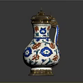 Ornate Ceramic Vase With Blue Red Floral Patterns And Gold Accents