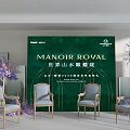 Elegant Floral Display Setup With Green Backdrop Purple Flowers And Chairs