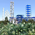 Beautiful Industrial Chemical Plant Scenery With Lush Green Plants Under Bright Cloudless Blue Sky
