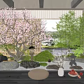 Tranquil Courtyard Garden With Cherry Blossom Tree Lantern Stones Round Cushion Bamboo And Wooden Floor