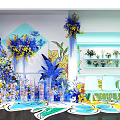 Floral Display Design With Blue Yellow Flowers Geometric Wall Decor And Shelf Vases