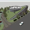 Modern Circular Building With Green Roof Surrounded by Trees Cars and Pedestrians