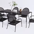 Outdoor Black Rattan Table And Chairs Set With Plant And Candle Holder Decor