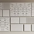 White Decorative Wall Panels Showcasing Various Perforated Patterns And Hole Designs 3d model