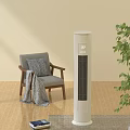 White Tower Air Cooler Fan in Indoor Room with Wooden Floor Gray Chair Green Plant